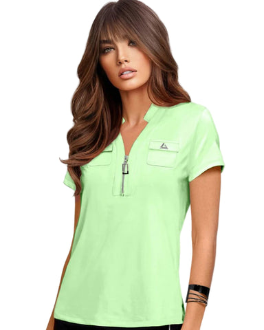 Woman wearing a light green polo shirt with a brand logo on a white background