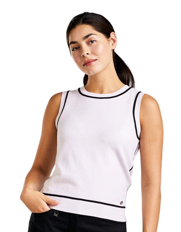 Woman wearing a white sleeveless top with black trim on a white background