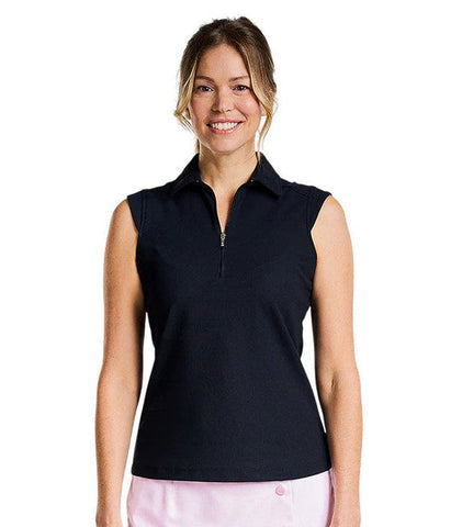 Woman wearing a black sleeveless polo shirt and pink skirt on a white background