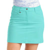 Turquoise skirt worn by a person on a white background