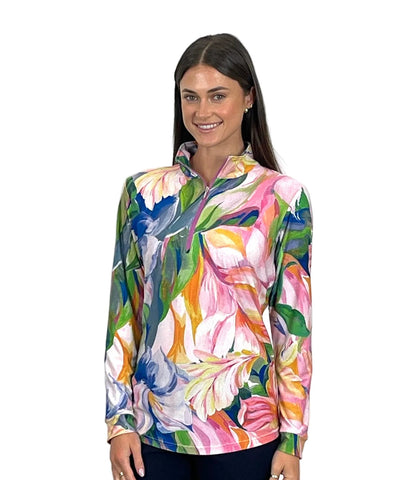 Woman wearing a colorful floral long-sleeve shirt on a white background