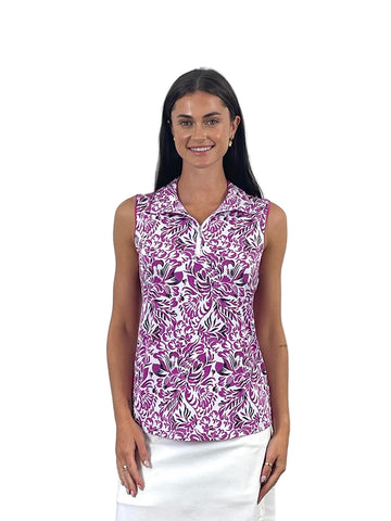 Woman wearing a sleeveless floral patterned top on a white background
