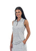 Woman wearing a sleeveless black and white patterned top