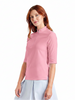 A woman modeling a light pink short-sleeve quarter-zip athletic top, shown in a full-body view on the left and a close-up crop of the upper chest/neck area on the right, against a plain white background.