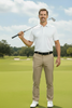 Greg Norman Mens Pants Microlux Bamboo lifestyle shot on golf course