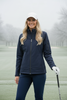 Woman golfer wearing Sporte Leisure Perisher Soft-Tec Navy Jacket on a cold winter golf course